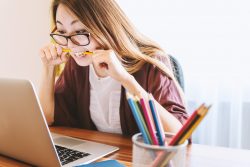 woman looking for remote jobs on laptop